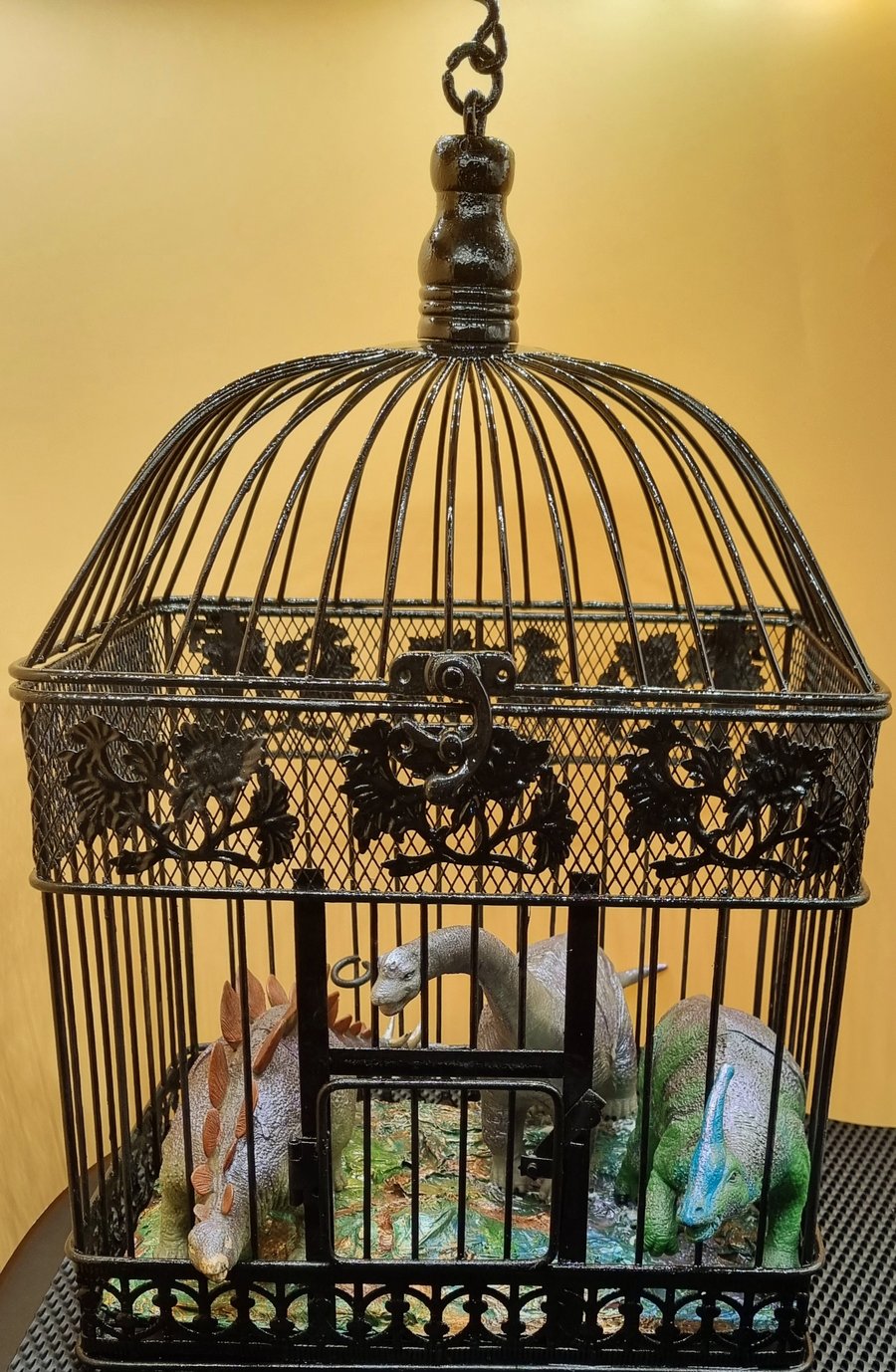 Dinosaurs in decorative Cage