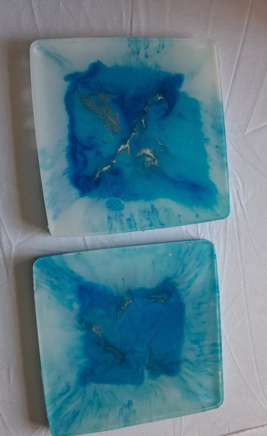 Set of two handmade epoxy resin square coasters. Blue and silver 