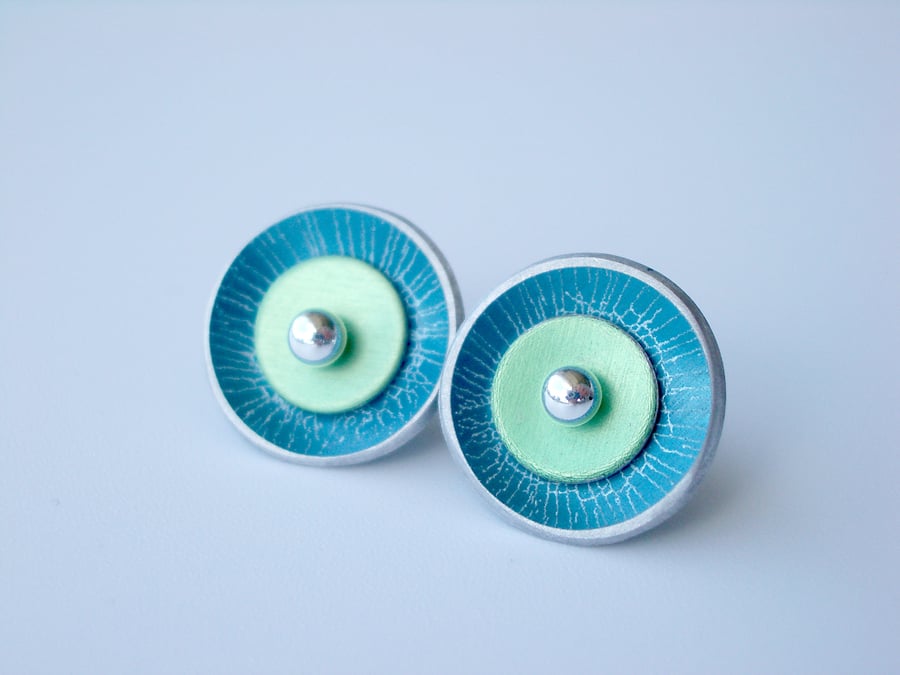 Circle studs in teal and green