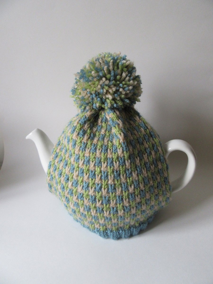 Knitted summer tweed tea pot cosie with oversized pompom