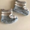 Three coloured hand knitted baby bootees