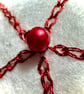 A Red and white star tree decorations with metallic thread and seed beads  - Image 3