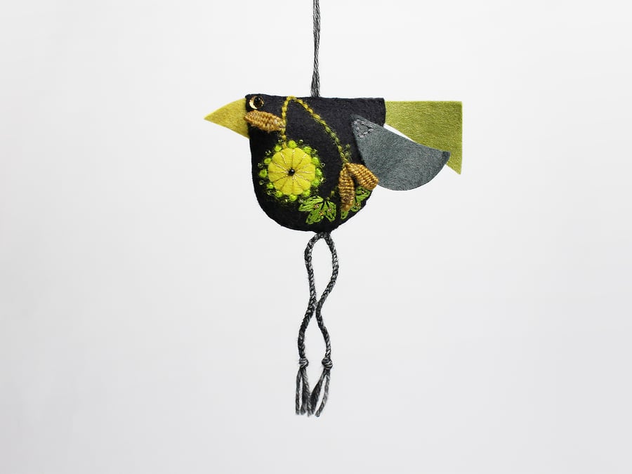 Black felt hand embroidered bird-shaped hanging decoration called Big Chixy