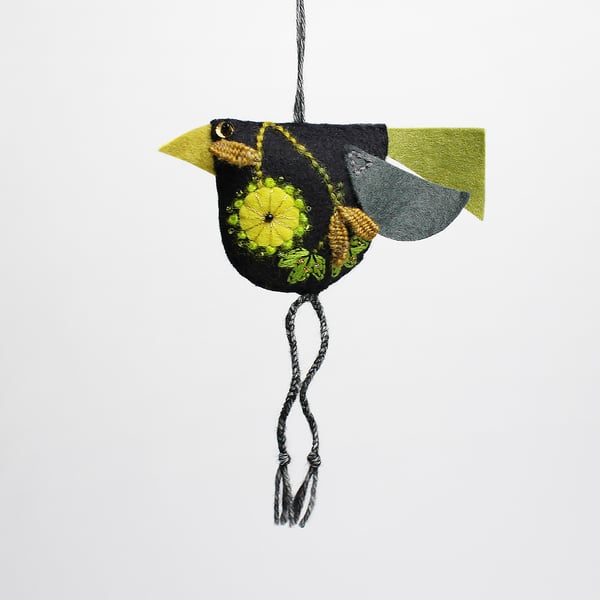Black felt hand embroidered bird-shaped hanging decoration called Big Chixy