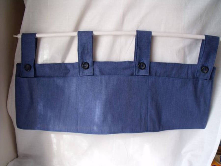 hanging bunk bed tidy with pockets to store books, controllers, toys.  10 x 30"