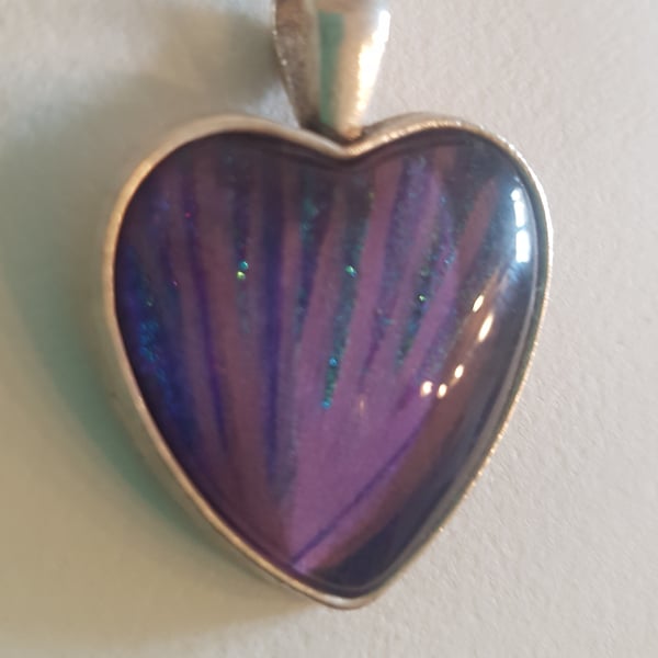 Heart shaped pendant,with tones of purple, lilac and aqua blue.