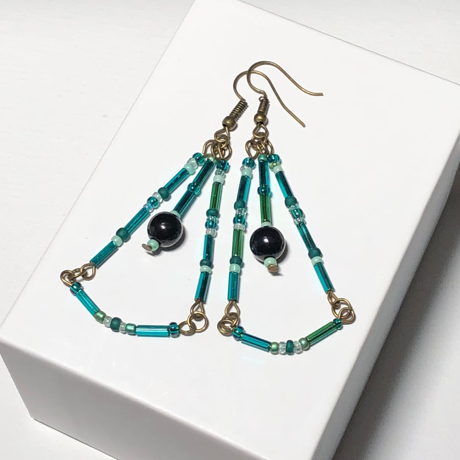 Long teal glass chandelier earrings
