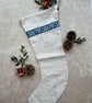 Joy Embroidered Linen Christmas Stocking with mirror braid