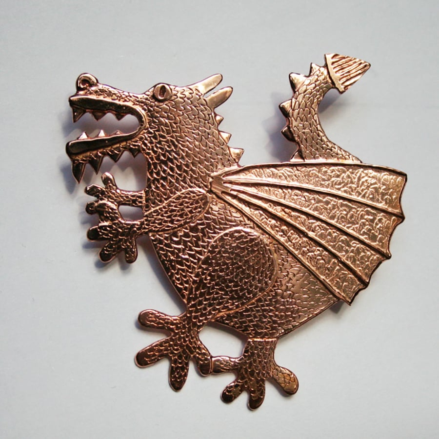 Dragon brooch copper