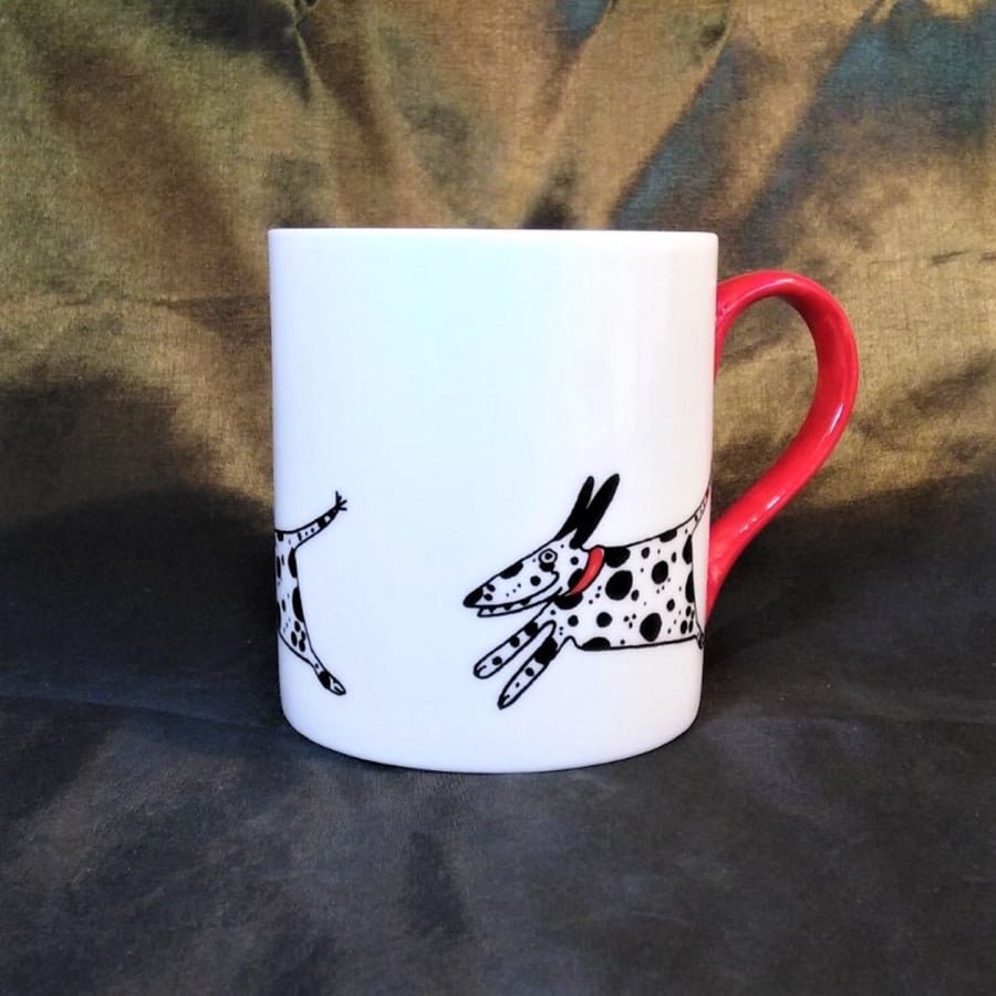 Spotty dog mug. Hand decorated with a happy running Dalmatians.