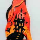Halloween hare in orange  with spooky castle too