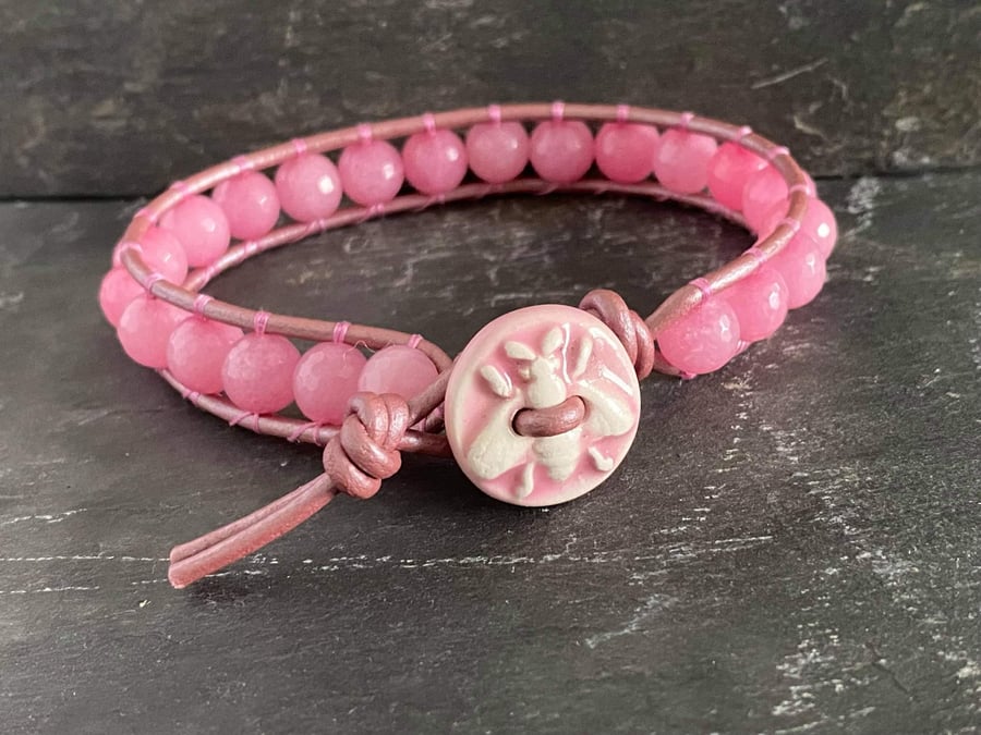 Pink rhodonite semi precious bead and leather bracelet with bee button fastener 