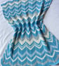 Off white and aqua baby blanket, hand knitted in 100% cotton yarn.
