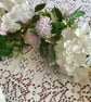 Handmade floral multi coloured, multi flowered garland table decoration. - Image 3