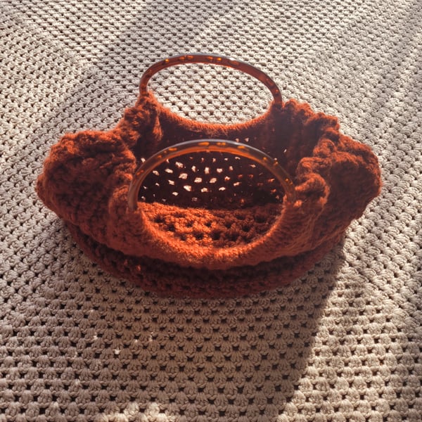 Hand crocheted bag in rust. 