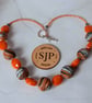 Handmade necklace in orange, black and white polymer clay - Image 3