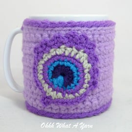 Crochet lilac peacock feather mug cosy, mug hug