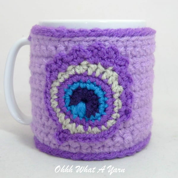 Crochet lilac peacock feather mug cosy, mug hug