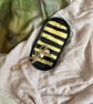 Black trinket tray with Golden stripes