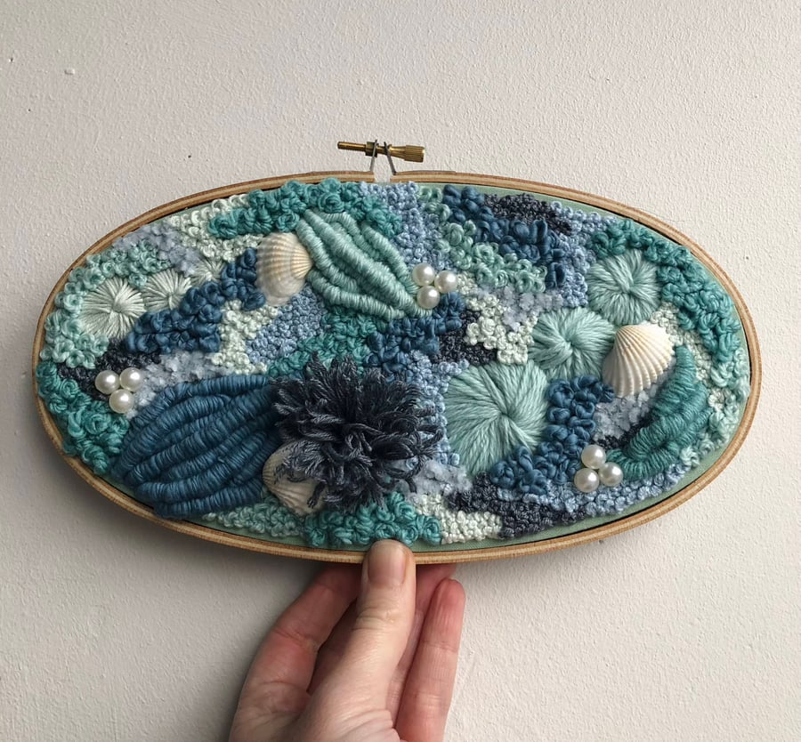 Worlds your oyster a hand embroidered art piece