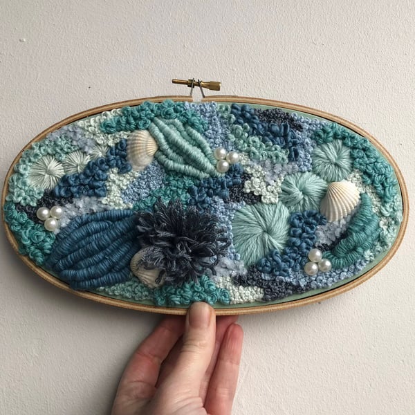 Worlds your oyster a hand embroidered art piece