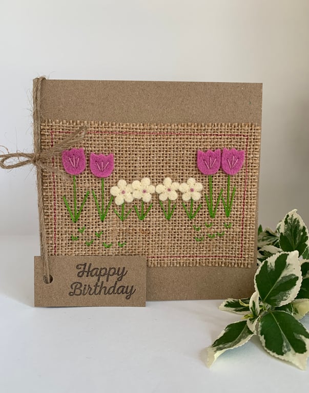 Handmade birthday card. Row of rose pink and cream flowers from wool felt.