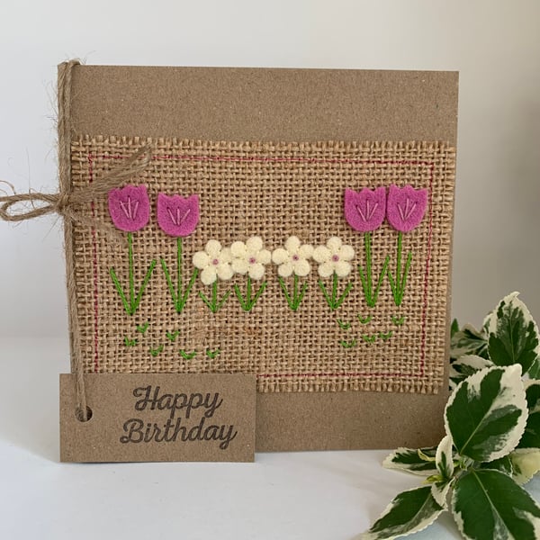 Handmade birthday card. Row of rose pink and cream flowers from wool felt.