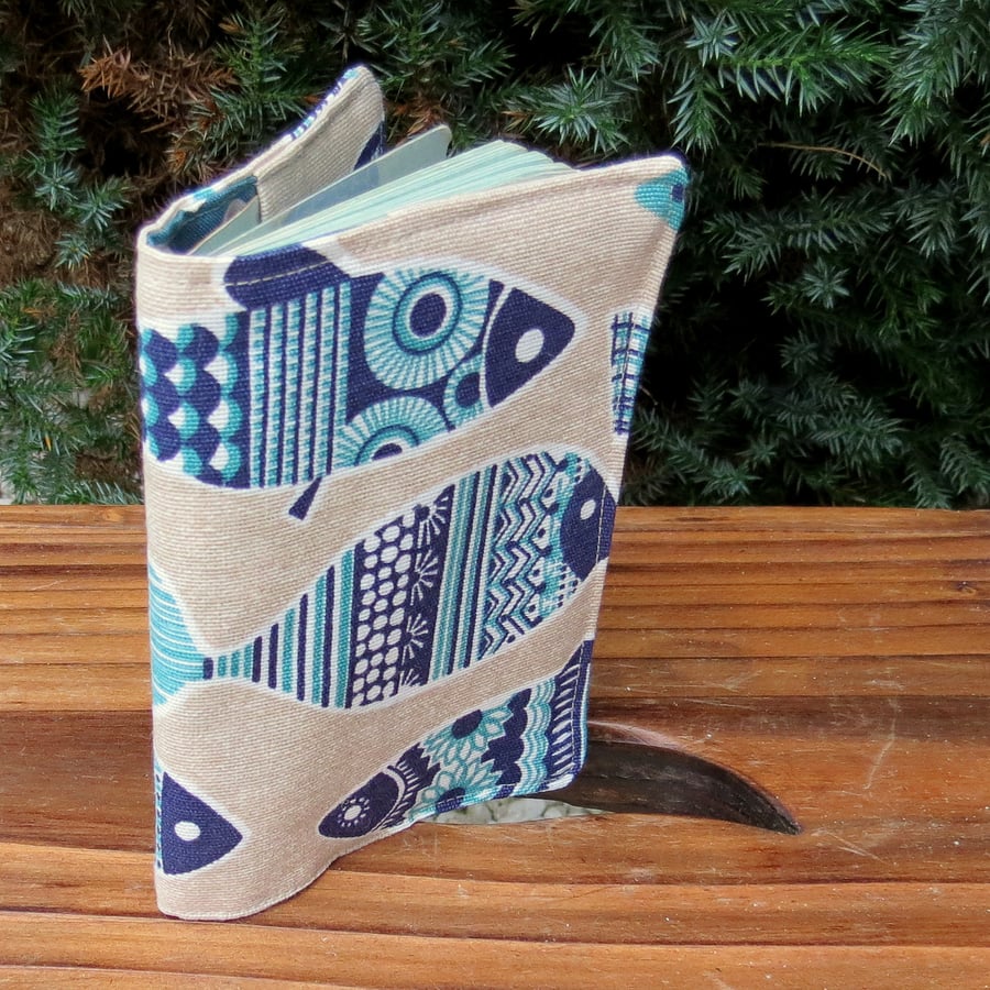 Blue fish.  A passport sleeve with a whimsical fish design.  Passport cover.