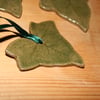 Handmade green ivy stoneware ceramic hanging decoration with green ribbon