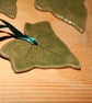 Handmade green ivy stoneware ceramic hanging decoration with green ribbon - Image 1