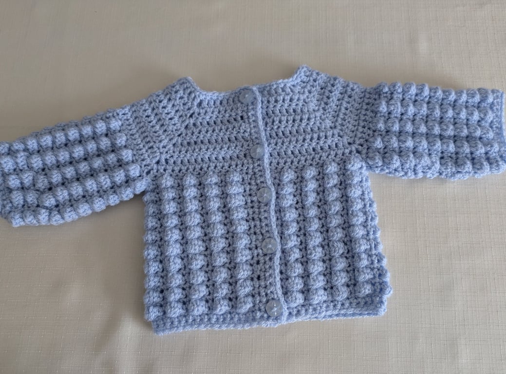 Newborn cardigans or jacket in baby blue for a newborn baby 