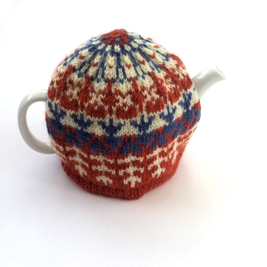 Orange knitted tea cosy