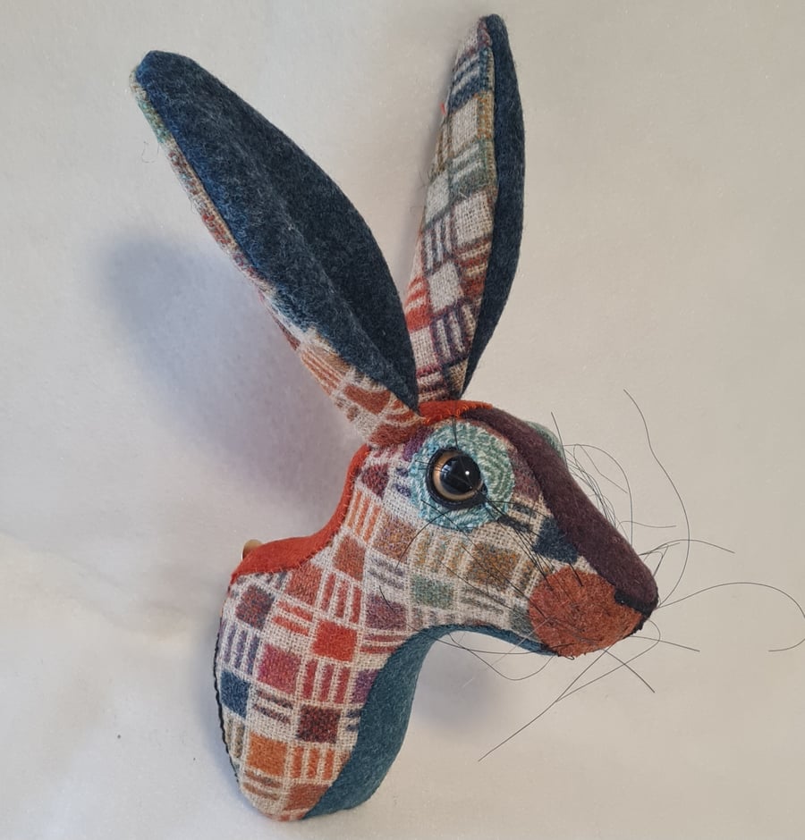 Faux hare head wall mount in harlequin Abraham Moon fabric