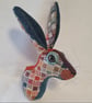 Faux hare head wall mount in harlequin Abraham Moon fabric