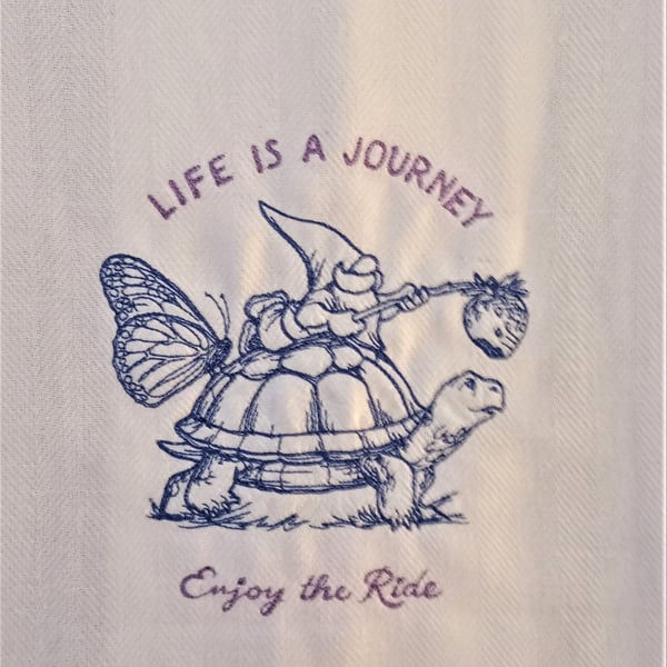 Gnome riding a tortoise - Life is a journey enjoy the ride tea towel
