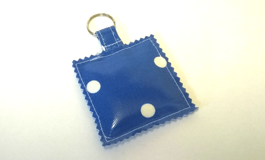 Key ring made in blue spotty oilcloth.