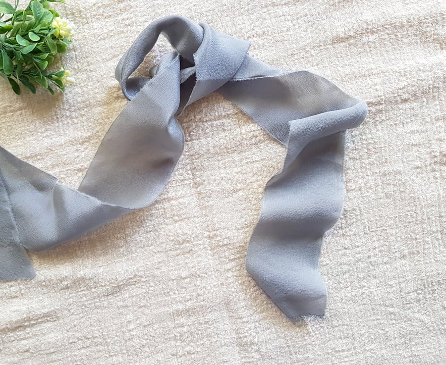 Silver grey 100% silk crepe de chine ribbon with raw edge
