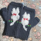 Navy blue mittens with a cat on and added flower embroidery