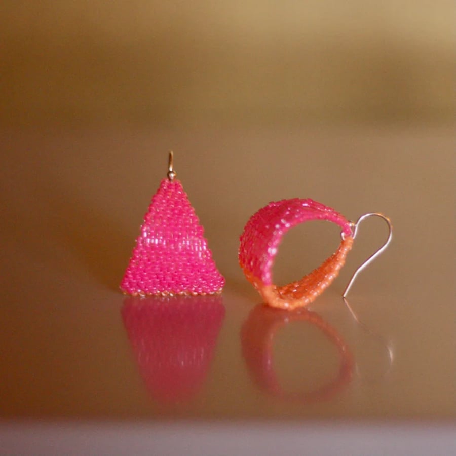 Hot pink and orange beaded hoop earrings. Handmade in a contemporary style.