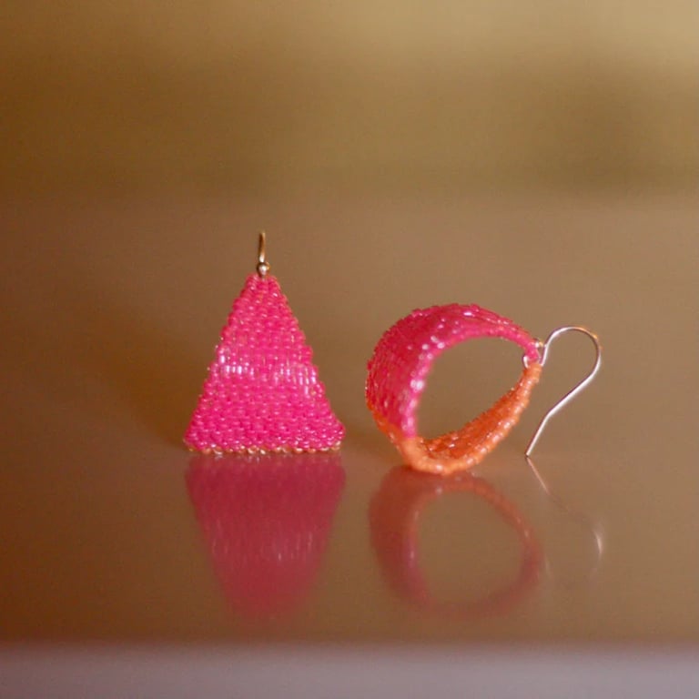 Hot pink and orange beaded hoop earrings. Handmade in a contemporary style.