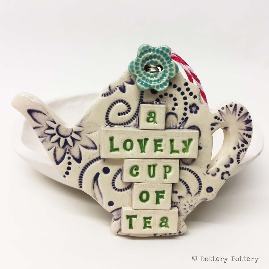 Ceramic teapot decoration with flower button pottery