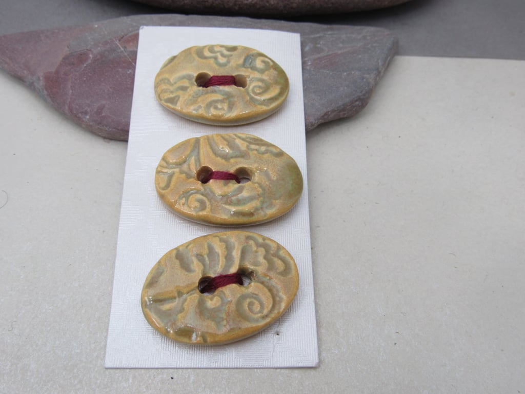 3 Medium Oval Old Gold Brocade Pattern Ceramic Buttons