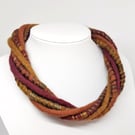 The Wrapped Twist: felted cord necklace in autumnal ruby, mustard and orange 