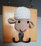 Crocheted sheep head on wooden board with hooks - Image 2