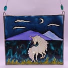 Handmade glass painted window hanging, unicorn, mountains, night sky