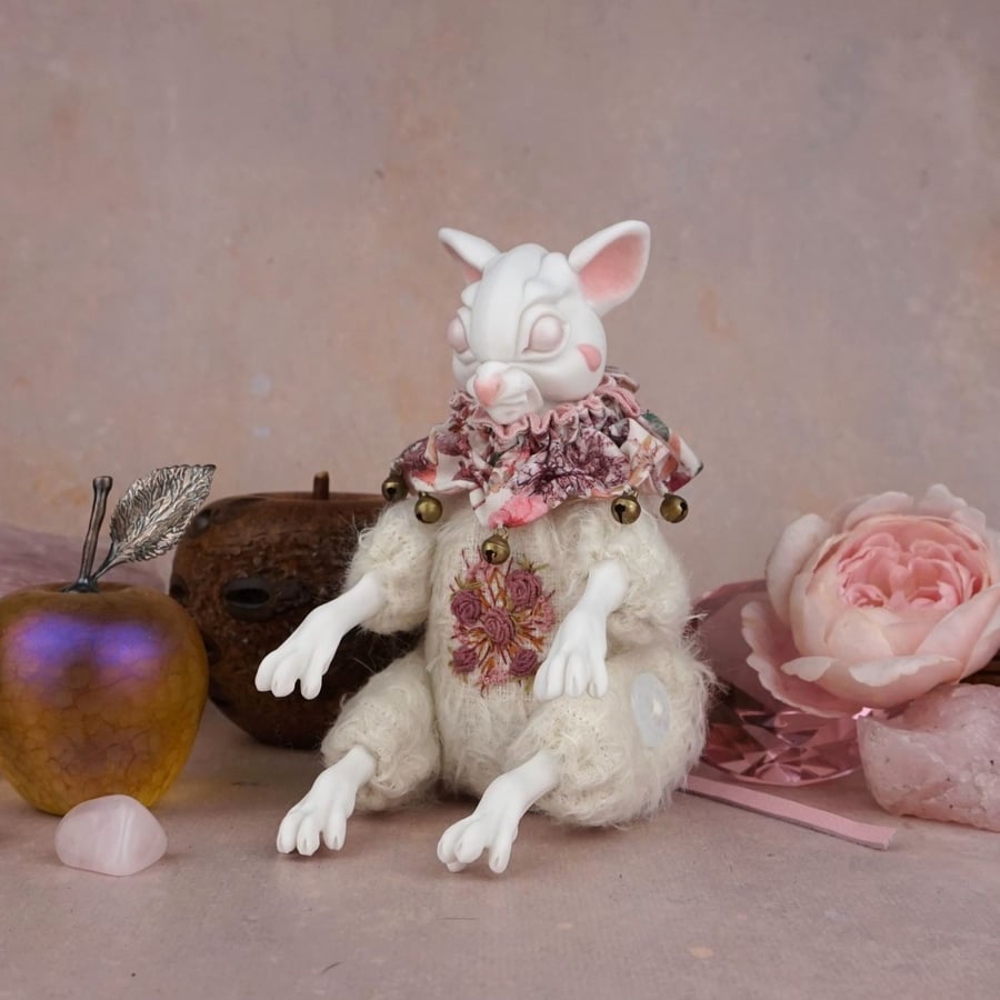 'Clement', a porcelain and textile mouse doll.
