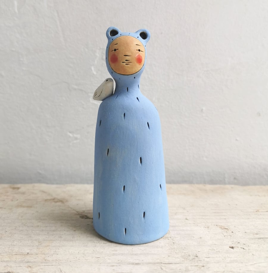 Ceramic miniature figurine Peculiar Person in sky blue and bird