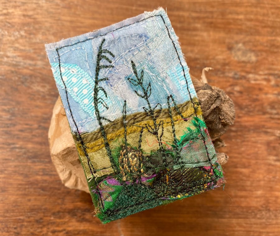Embroidered up-cycled hedgerow landscape brooch pin or badge. 