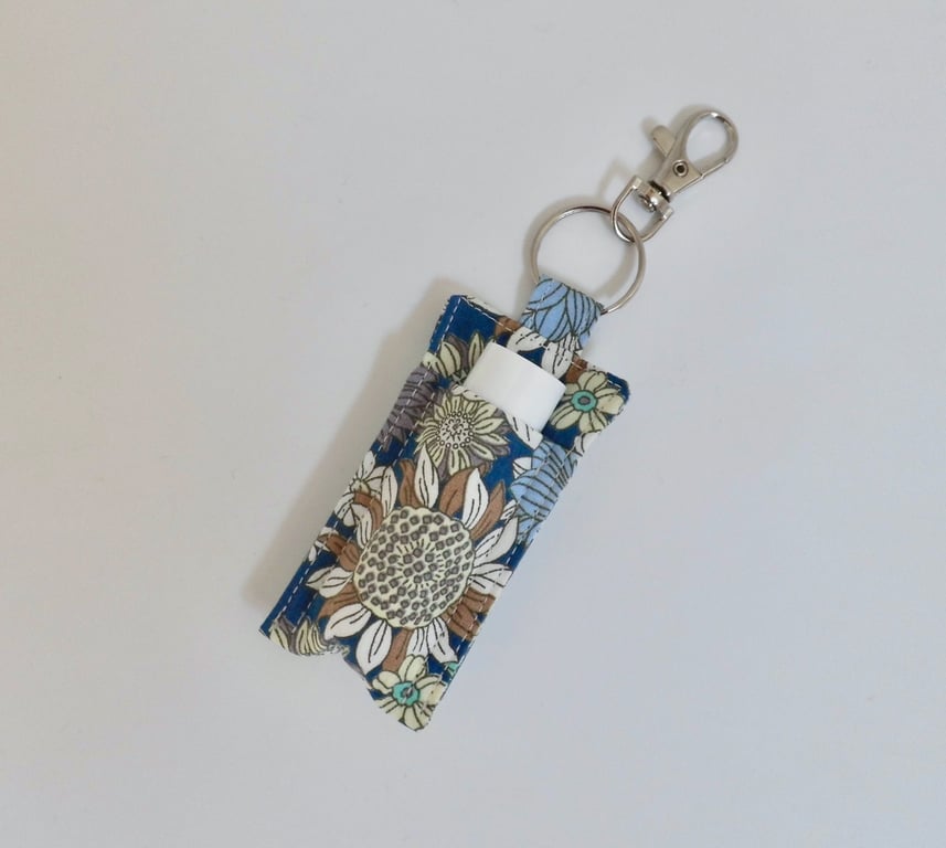 Key ring lip balm holder in modern floral print.