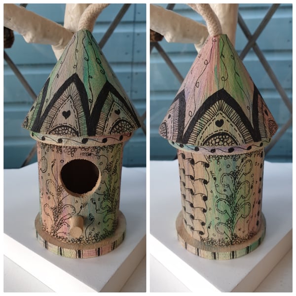 Hand drawn zentangle peacock birdhouse 